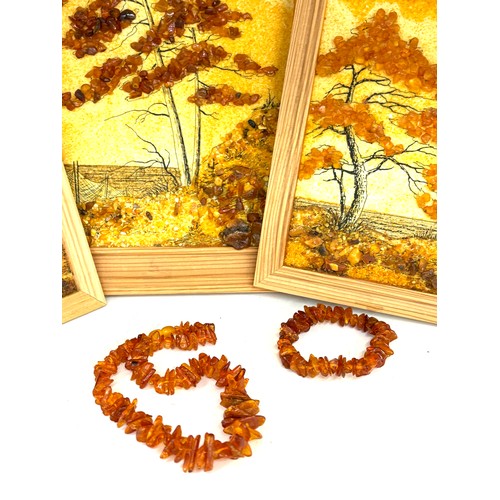 97 - Framed amber beads and a selection of amber beads