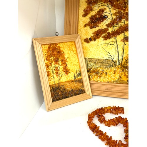 97 - Framed amber beads and a selection of amber beads