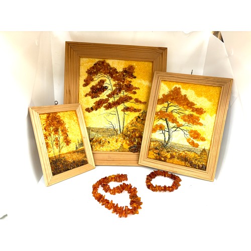 97 - Framed amber beads and a selection of amber beads