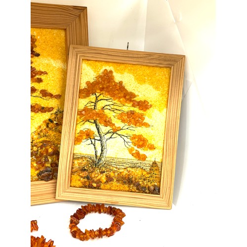 97 - Framed amber beads and a selection of amber beads