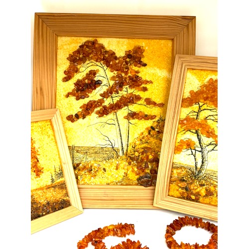 97 - Framed amber beads and a selection of amber beads