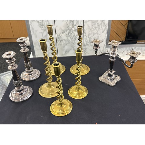 122 - Selection of brass barley twist and EPNS candle sticks and a candelabra