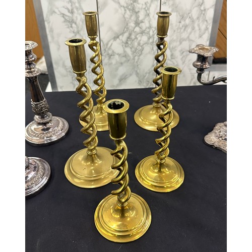 122 - Selection of brass barley twist and EPNS candle sticks and a candelabra