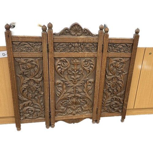 592 - Heavily carved oak fire screen measures approx 35 inches tall by 35 wide