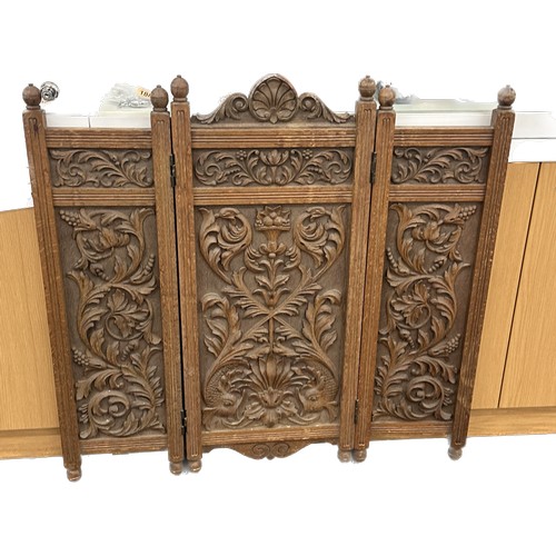 592 - Heavily carved oak fire screen measures approx 35 inches tall by 35 wide