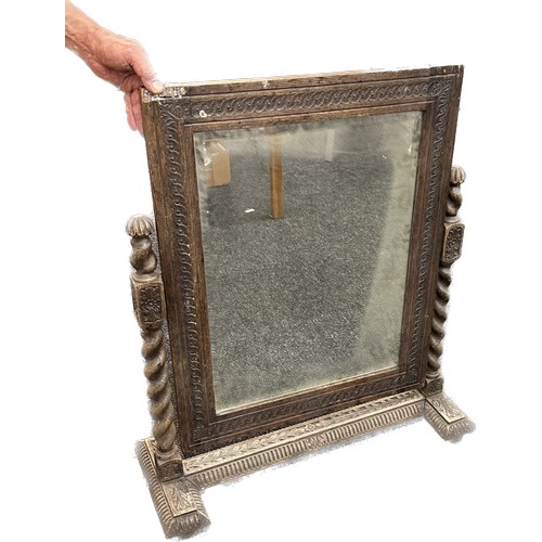 601 - Heavy oak barley twist swinging mirror on carved stand measures approx 27 inches wide by 33 inches t... 