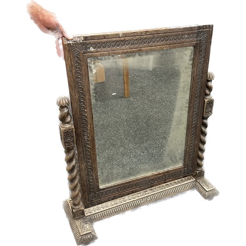 601 - Heavy oak barley twist swinging mirror on carved stand measures approx 27 inches wide by 33 inches t... 