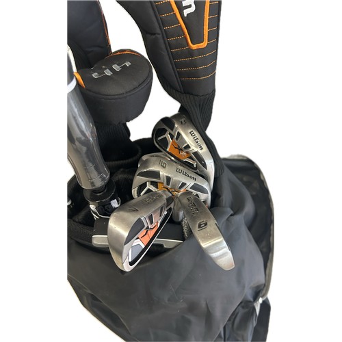 245 - Set Wilson golf clubs with case, club covers