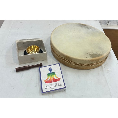 156 - Selection of meditating items to include 14' ocean drum, medium tibetan singing bowl and ' The Book ... 