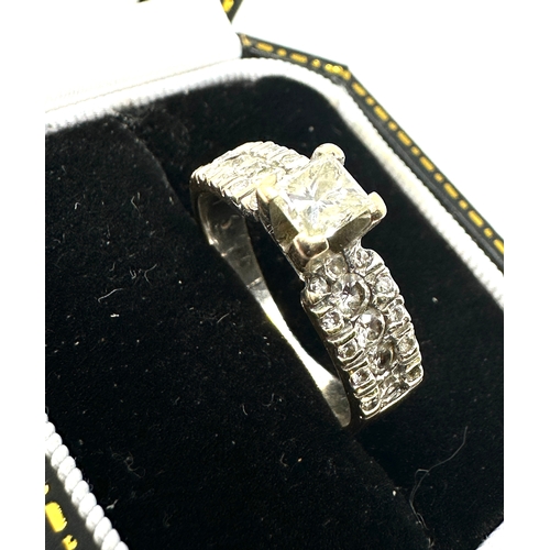 134 - 18ct gold diamond ring central diamond measures 4mm by 4mm with diamond shoulders approx weight 4g