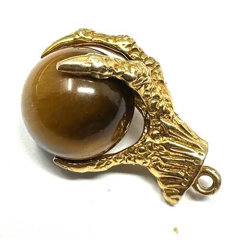 137 - 9ct gold claw & tigers eye ball pendant measures approx 2.2cm drop weight 8.5g