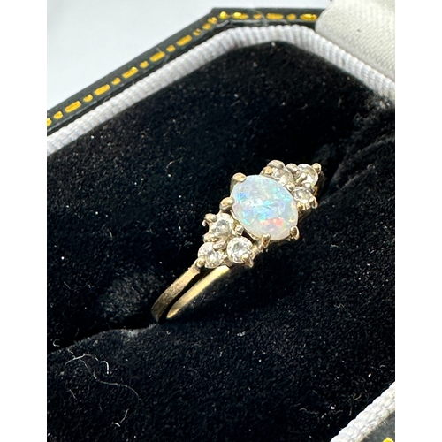 153 - 9ct gold opal & white gemstone ring weight 1.1g