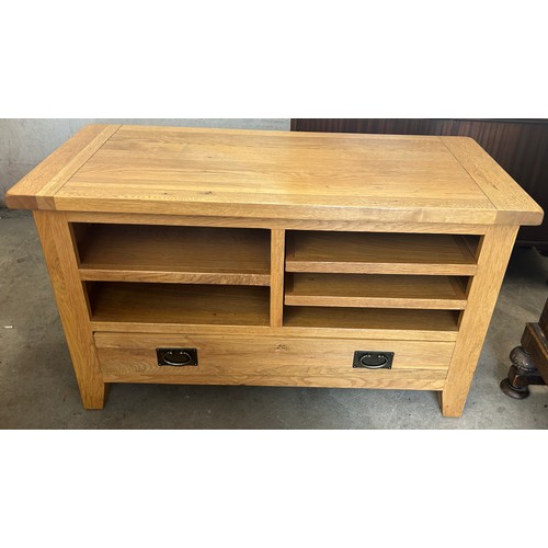 555 - Modern  one drawer light oak tv cabinet, approximate measurements: Height 26 inches, Width 43 inches... 