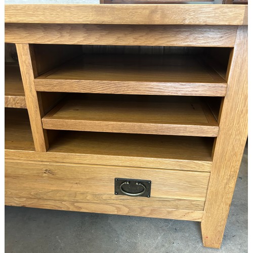 555 - Modern  one drawer light oak tv cabinet, approximate measurements: Height 26 inches, Width 43 inches... 