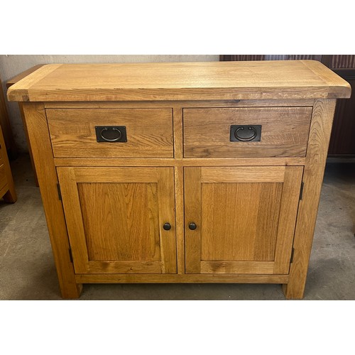 549 - 2 Door, 2 Drawer light oak small sideboard, approximate measurements: Height 34 inches, Width 41 inc... 