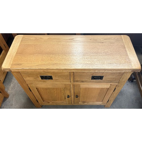 549 - 2 Door, 2 Drawer light oak small sideboard, approximate measurements: Height 34 inches, Width 41 inc... 