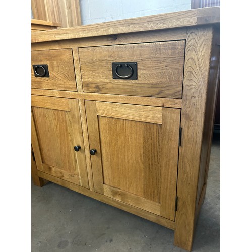 549 - 2 Door, 2 Drawer light oak small sideboard, approximate measurements: Height 34 inches, Width 41 inc... 