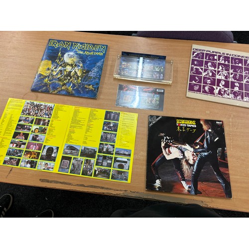 23 - Selection of assorted records includes Iron Maiden stamps, Deep purple etc