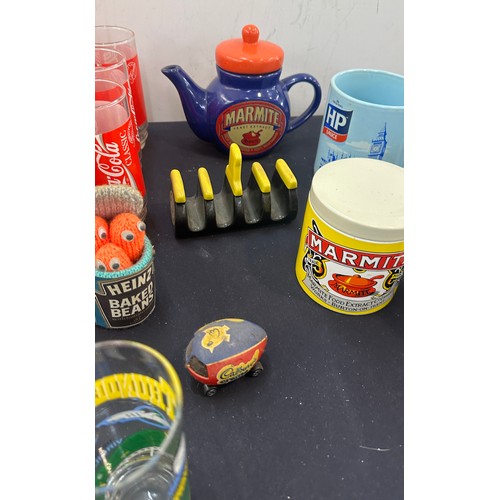 154 - Selection of advertising items to include Marmite tea pot, Heinz baked beans, set of 6 Coca Cola gla... 