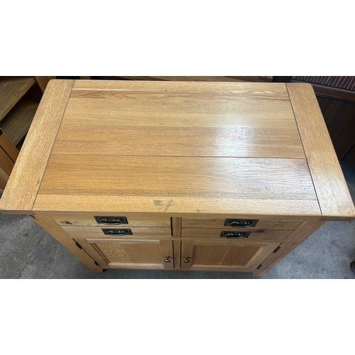 560 - 2 Drawer, 2 door light oak sideboard, approximate measurements: Height 36 inches, Width 39 inches, D... 