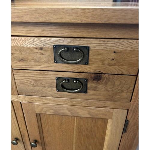 560 - 2 Drawer, 2 door light oak sideboard, approximate measurements: Height 36 inches, Width 39 inches, D... 