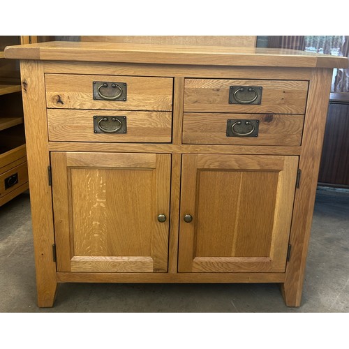 560 - 2 Drawer, 2 door light oak sideboard, approximate measurements: Height 36 inches, Width 39 inches, D... 