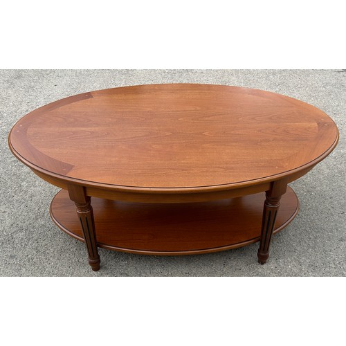 545 - Mahogany oval coffee table with shelf beneath, very clean condition, approximate measurements: Heigh... 