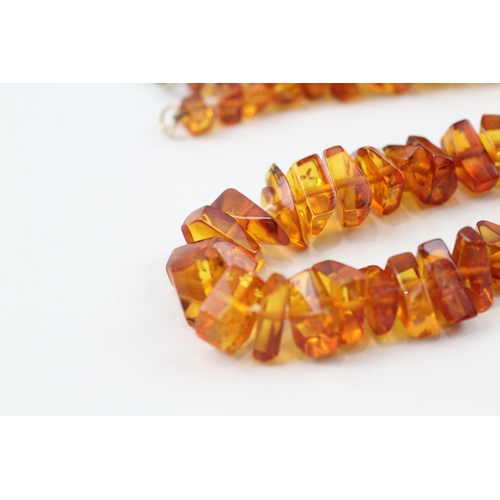 199 - 9ct gold amber necklace (22.5g)