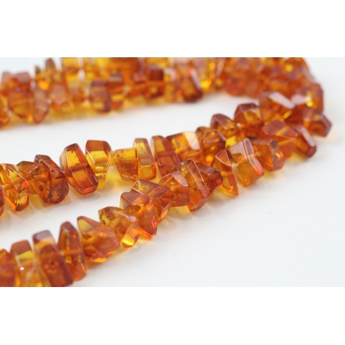 199 - 9ct gold amber necklace (22.5g)