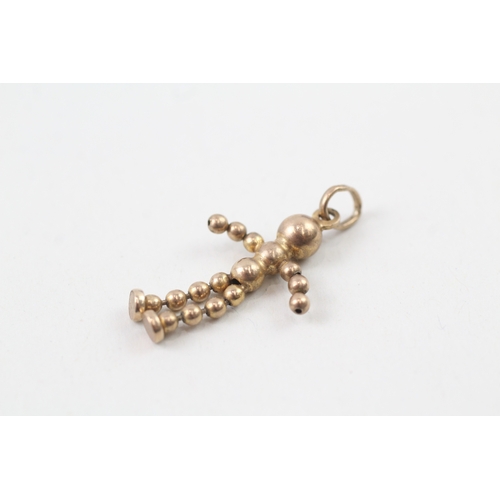 235 - 9ct gold articulated ball doll charm (1.5g)