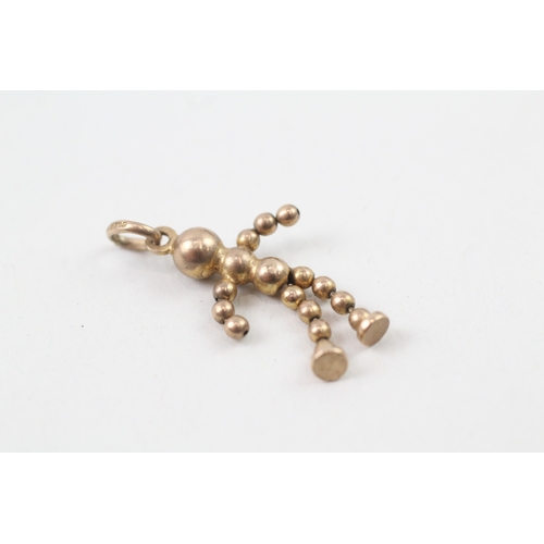 235 - 9ct gold articulated ball doll charm (1.5g)