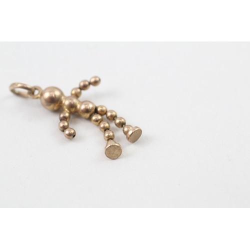 235 - 9ct gold articulated ball doll charm (1.5g)