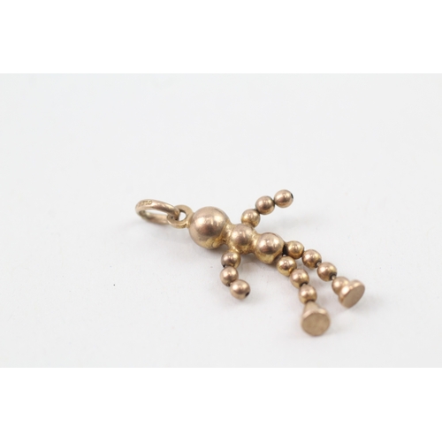 235 - 9ct gold articulated ball doll charm (1.5g)