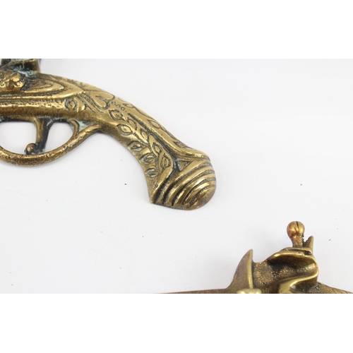 448 - Brass Ornamental Wall Pistols x 3 1050g