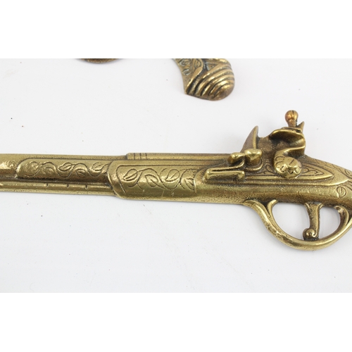 448 - Brass Ornamental Wall Pistols x 3 1050g