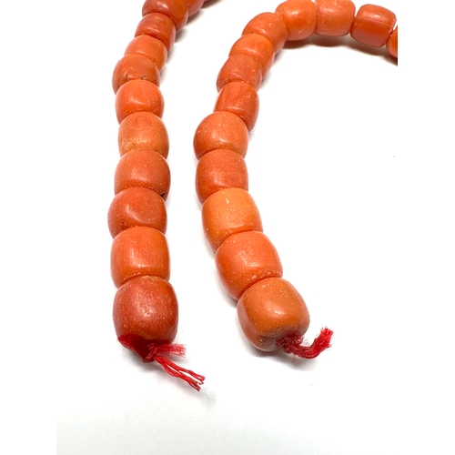 166 - Antique coral beads bracelet / necklace weight 34g beads measure approx 7mm by 6mm length 13ins long