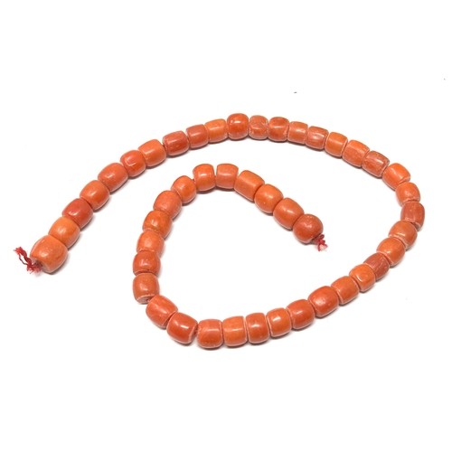 167 - Antique coral beads bracelet / necklace weight 35g beads measure approx 7mm by 6mm length 13ins long