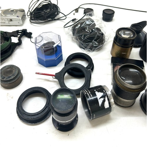 84 - Selection of lenses and one fine pix camera etc, untested