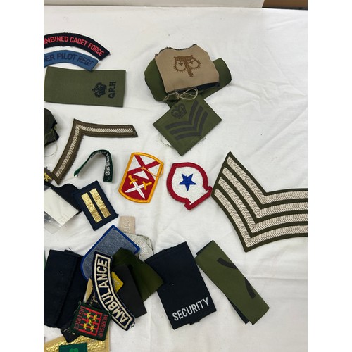 75 - Selection of military cloth badges