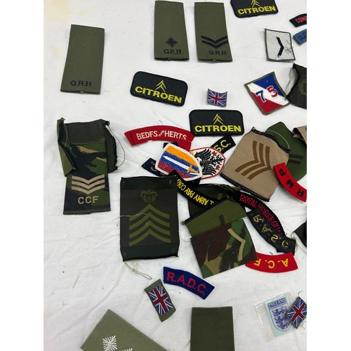 75 - Selection of military cloth badges