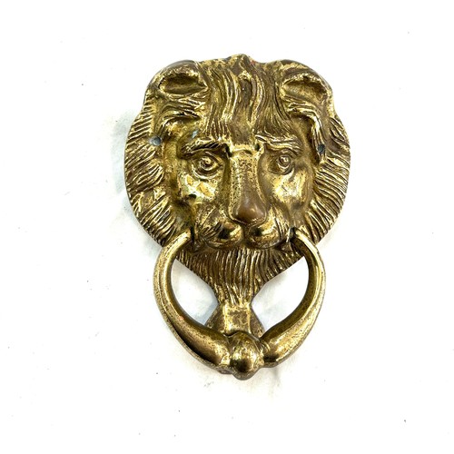 504 - Vintage lion head brass door knocker measures approx 6 inches long by 5 inches wide