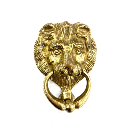 504 - Vintage lion head brass door knocker measures approx 6 inches long by 5 inches wide