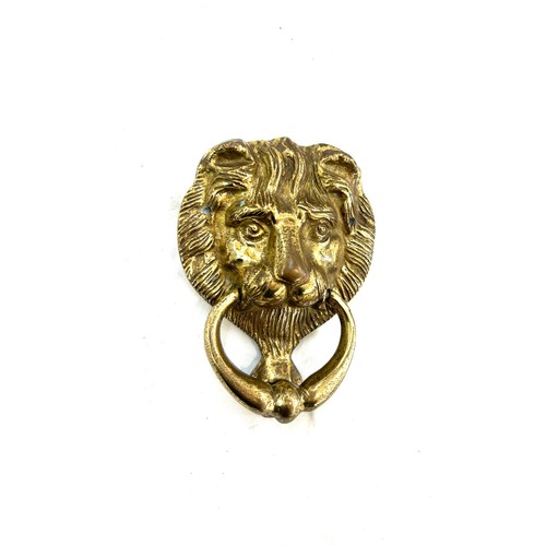 504 - Vintage lion head brass door knocker measures approx 6 inches long by 5 inches wide