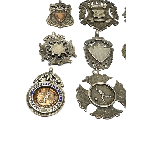 81 - 10 antique silver fobs