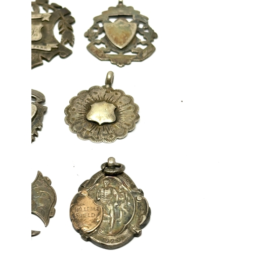 81 - 10 antique silver fobs