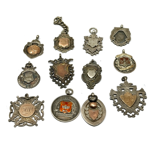 82 - 12 antique silver fobs