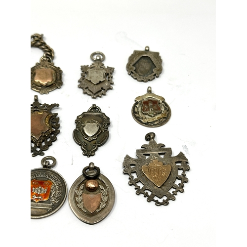 82 - 12 antique silver fobs