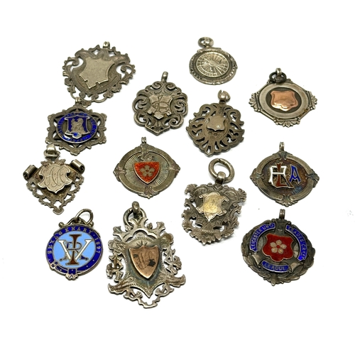 83 - 12 antique silver fobs