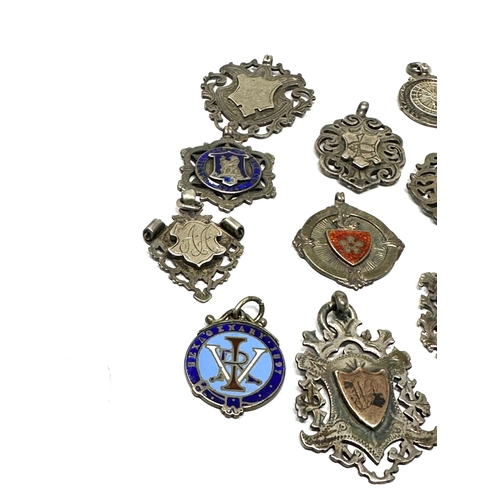 83 - 12 antique silver fobs