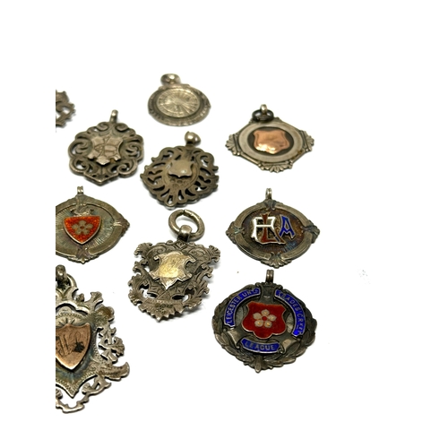 83 - 12 antique silver fobs